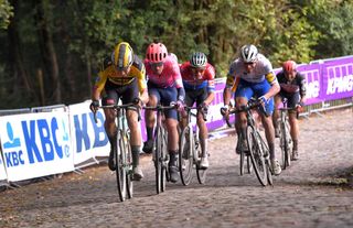 WEVELGEM BELGIUM OCTOBER 11 Wout Van Aert of Belgium and Team Jumbo Visma Alberto Bettiol of Italy and Team EF Pro Cycling Mathieu Van Der Poel of The Netherlands and Team AlpecinFenix Florian Senechal of France and Team Deceuninck QuickStep Breakaway Cobblestones during the 82nd GentWevelgem In Flanders Fields 2020 Men Elite a 2325km race from Ypres to Wevelgem GentWevelgem FlandersClassic on October 11 2020 in Wevelgem Belgium Photo by Luc ClaessenGetty Images