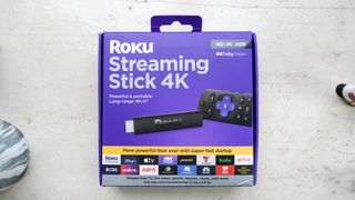 The Roku Streaming Stick 4K box on a windowsill