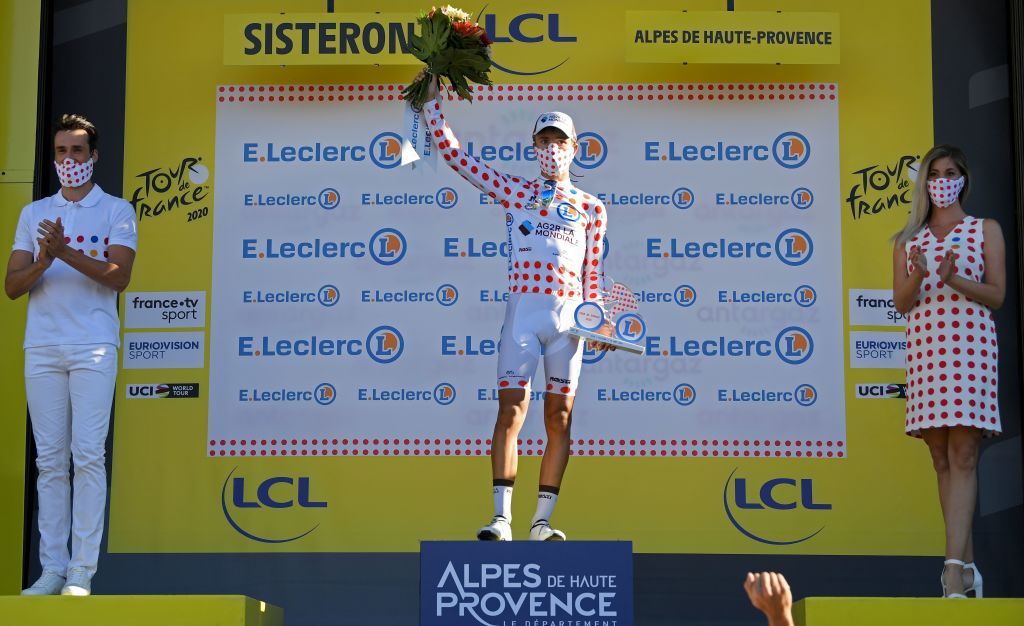 Team AG2R La Mondiale rider Frances Benoit Cosnefroy celebrates his best climbers polka dot jersey on the podium at the end of the 3rd stage of the 107th edition of the Tour de France cycling race 198 km between Nice and Sisteron on August 31 2020 Photo by Stuart Franklin various sources AFP Photo by STUART FRANKLINAFP via Getty Images