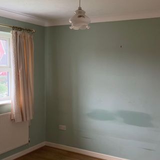 before of an empty room with pink curtains