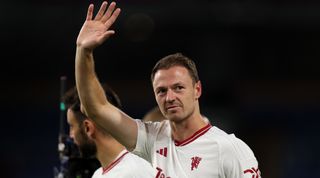 Jonny Evans of Manchester United waves to the fans at full time during the Premier League match between Burnley FC and Manchester United at Turf Moor on September 23, 2023 in Burnley, England.