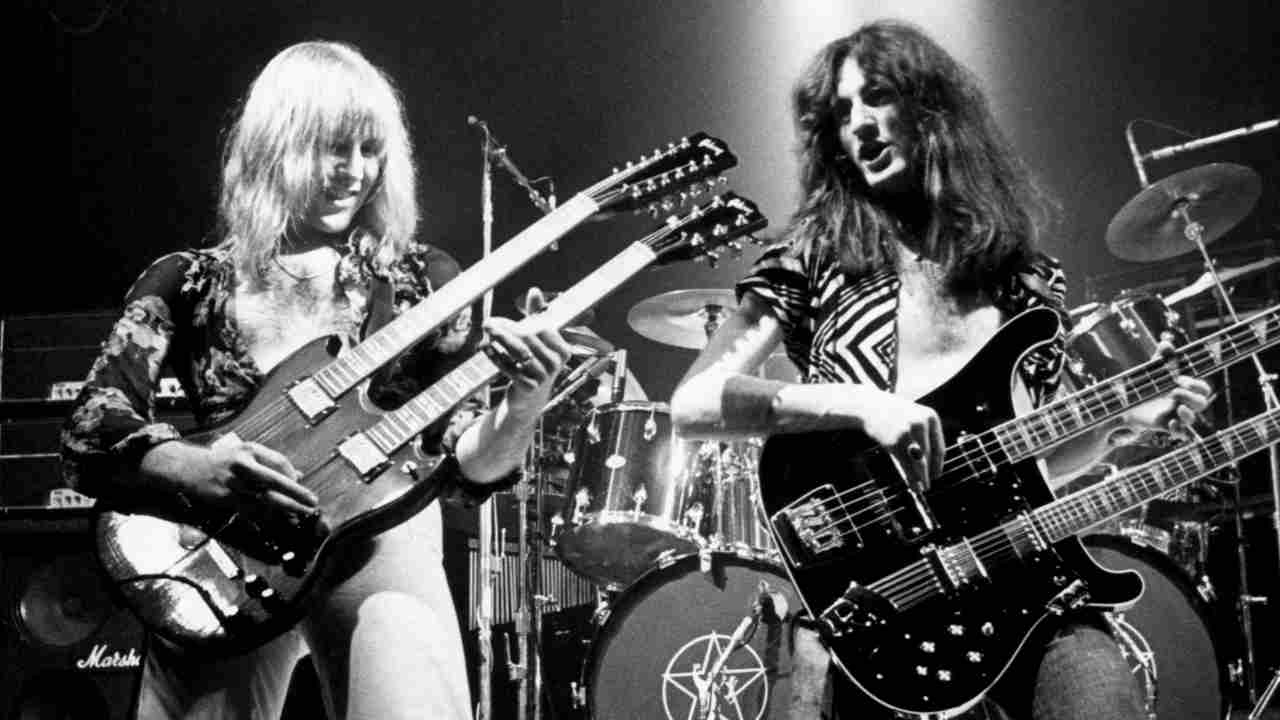 Rush’s Geddy Lee and Alex Lifeson performing onstage in the 1970s