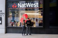 People outside NatWest Bank in the City of London