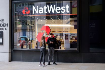 People outside NatWest Bank in the City of London