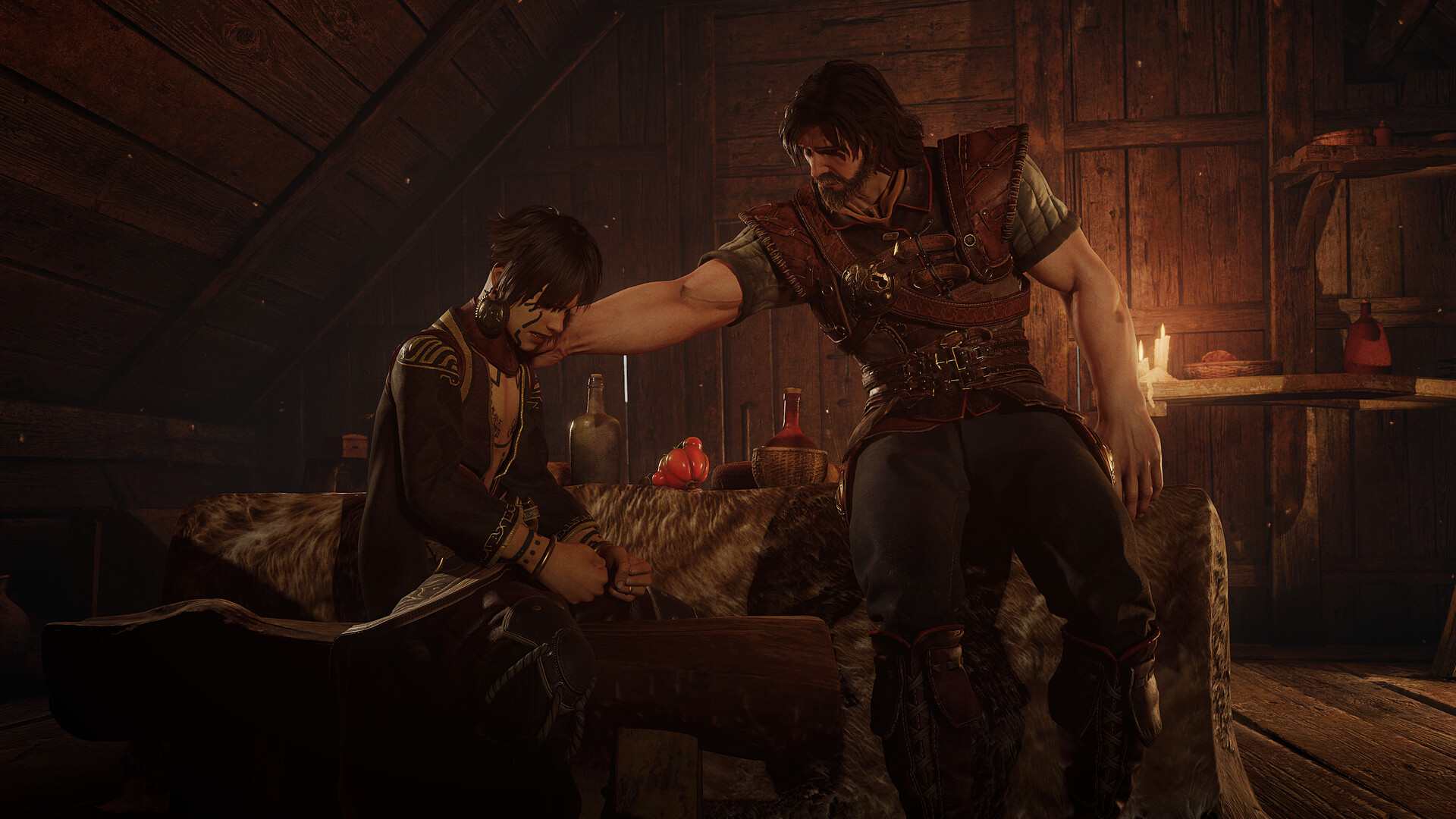 Blades of Fire's protagonist Aran comforts another character in a tavern bedroom.