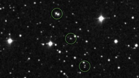 images of stars on a black background, with what appear to be other stars among them circled by dotted lines