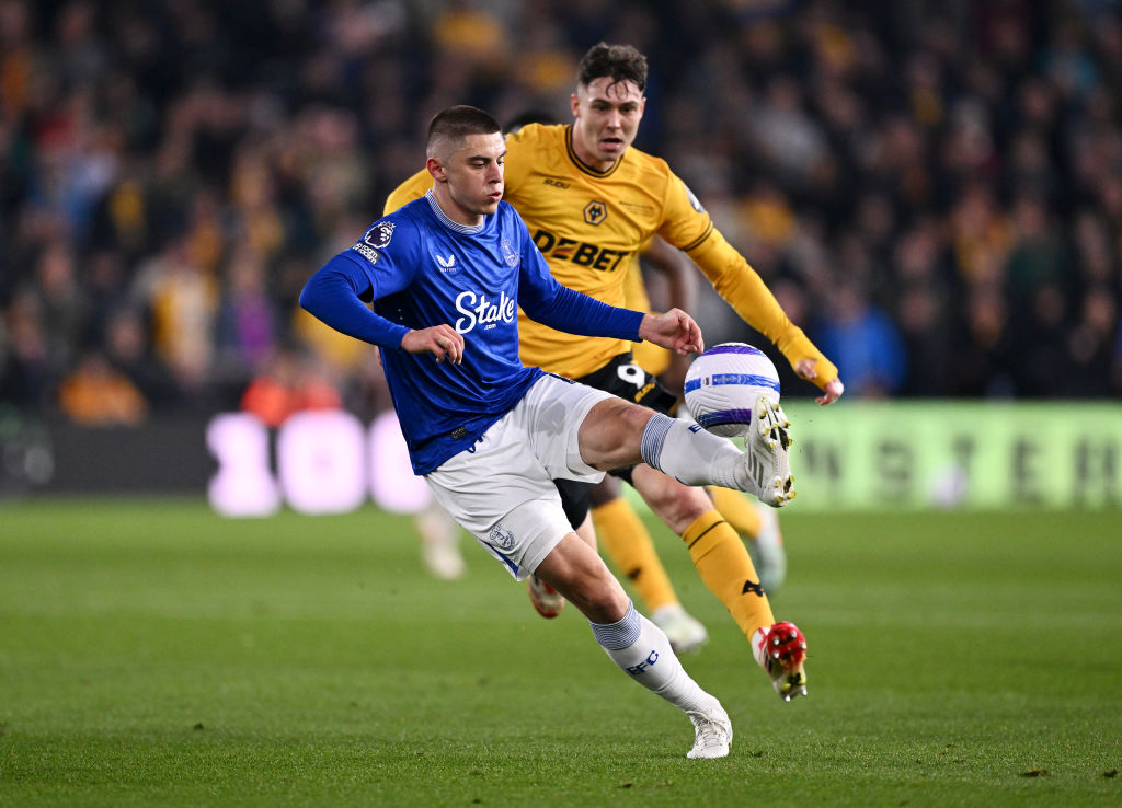 Everton&#039;s Vitaliy Mykolenko controls the ball under pressure from Wolves&#039; Jorgen Strand Larsen