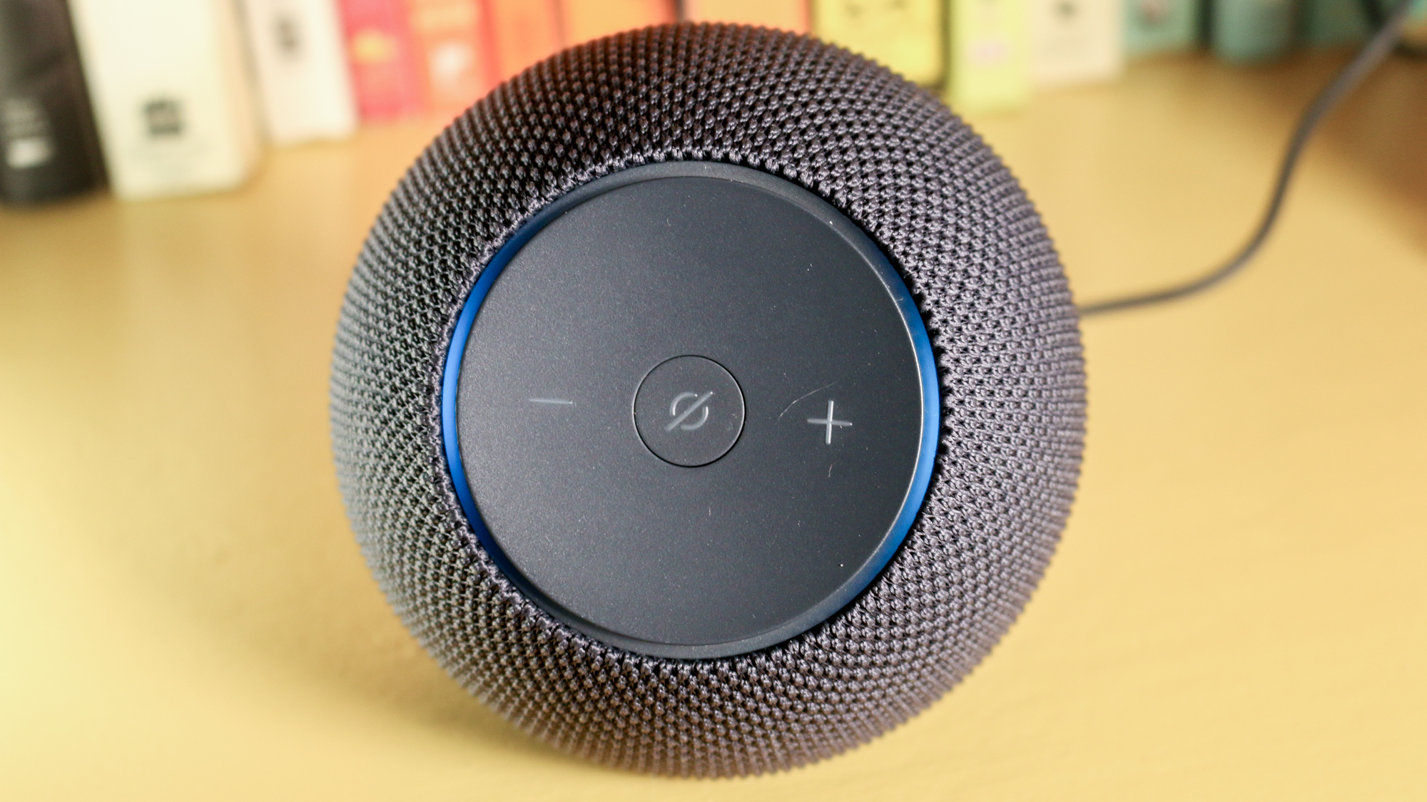 Echo Dot Max on a book shelf