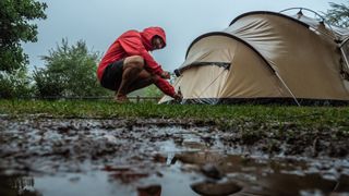 Pitching in a tent in a rain storm
