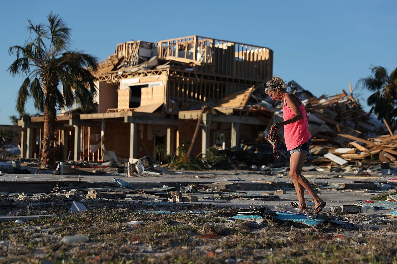 A Florida resident amid hurricane debris