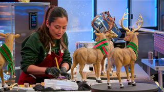 Is it Cake? Holiday contestant April Julian designing a cake of reindeers in scarves on the baking competition show