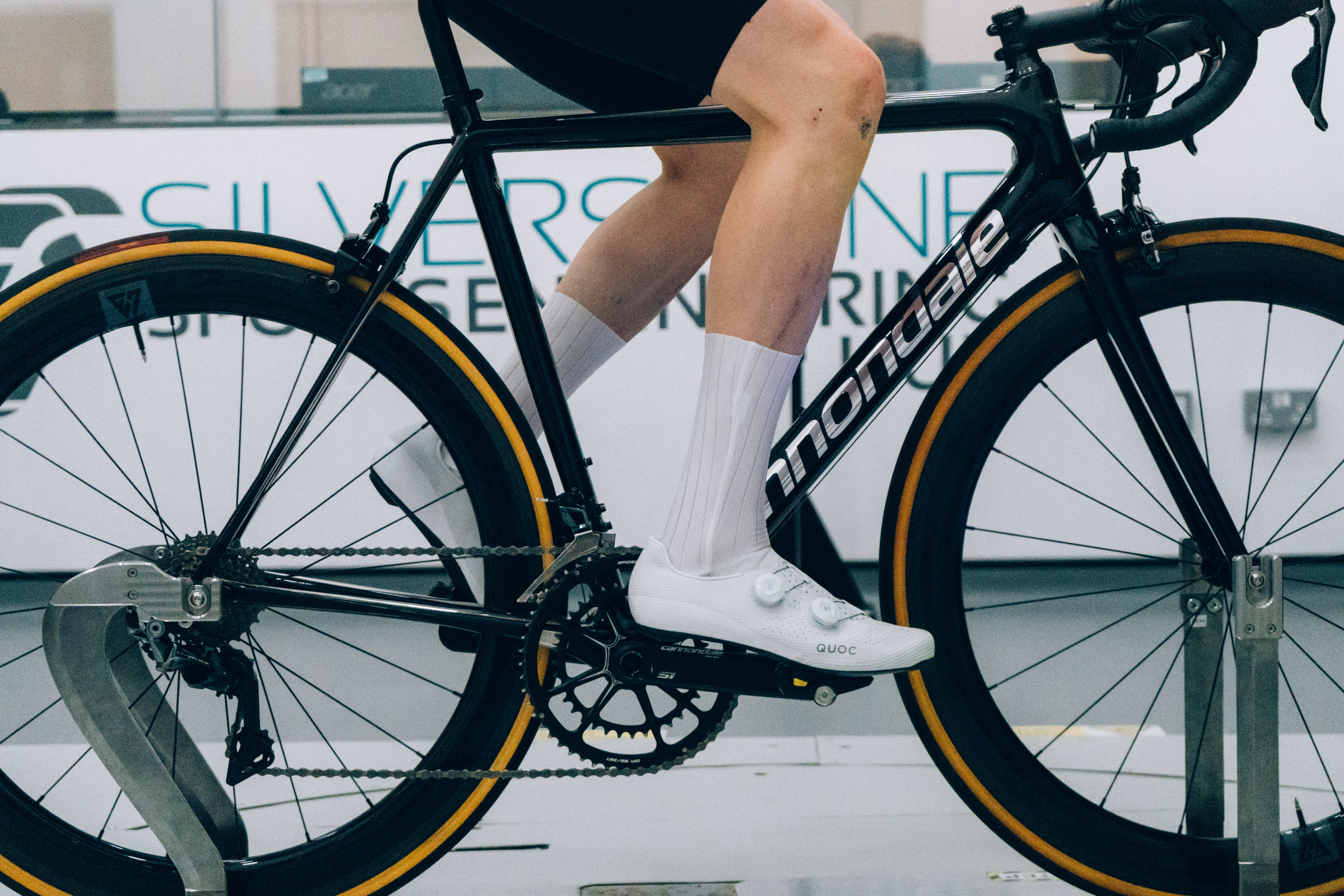 A close up of the socks that Tom is wearing while riding a bike in the wind tunnel