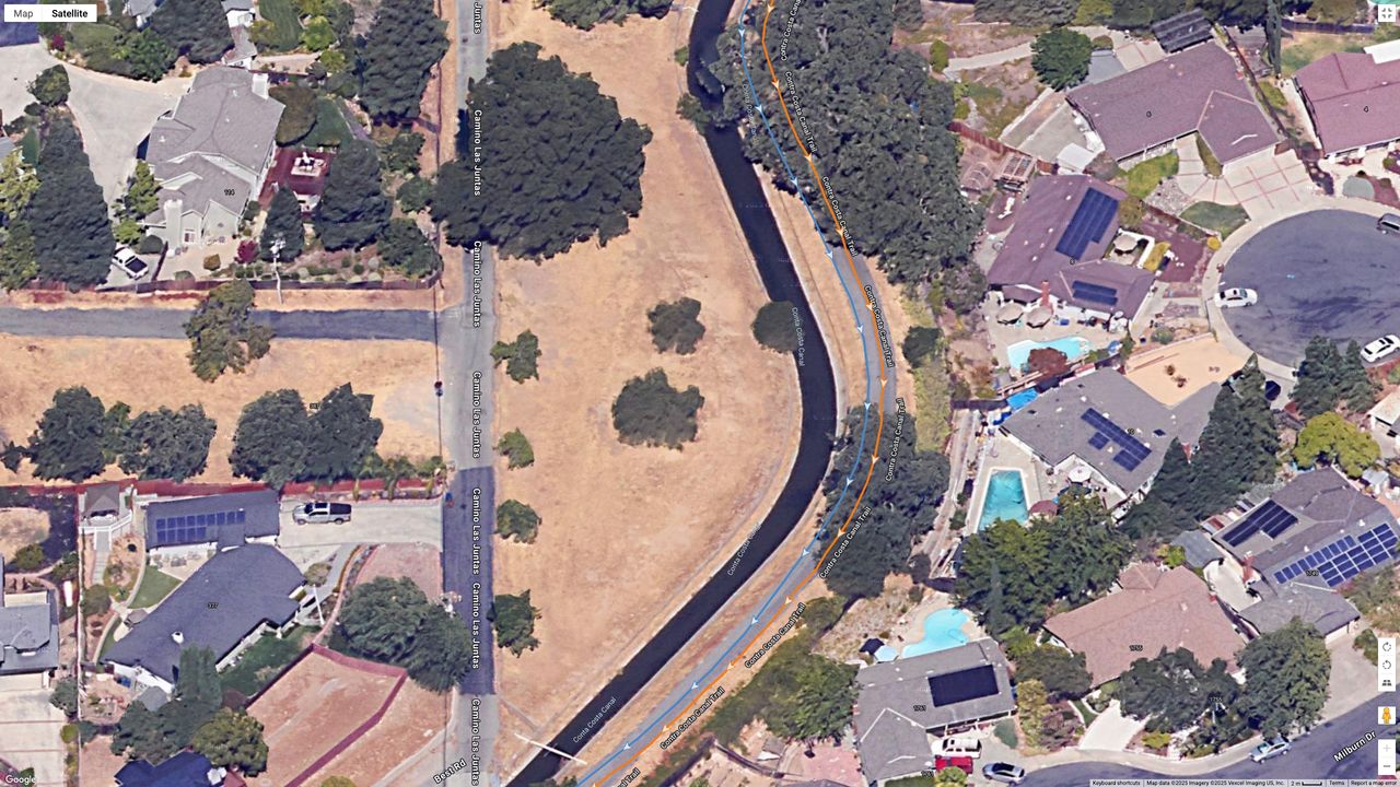 A Google Maps top-down view showing GPS lines for the Garmin Forerunner 970 (orange) and COROS PACE Pro (blue) indicating a running path.