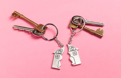 Divorce house keys on pink