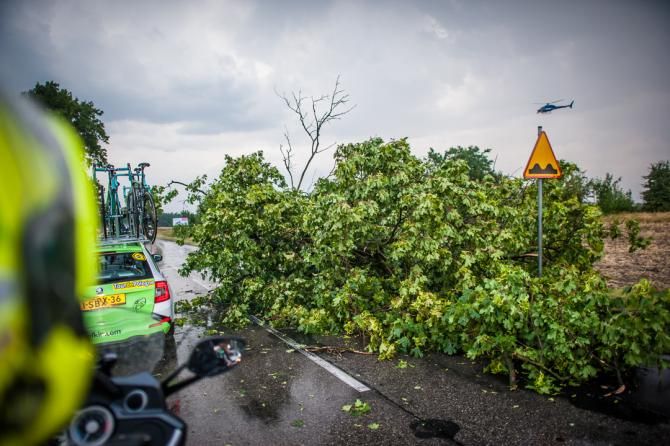 A tree blocks the road after a storm hit stage 1 of the Tour of Poland