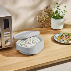 Silvercrest microwave rice cooker on wood kitchen countertop.