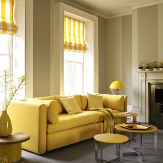 striped blinds in canary yellow with sofa and grey walls