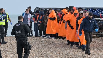 Migrants helped ashore in Kent on 12 October