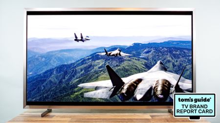 The Samsung S95H QD-OLED TV alongside a badge that reads: "Tom's Guide TV Brand Report Card"