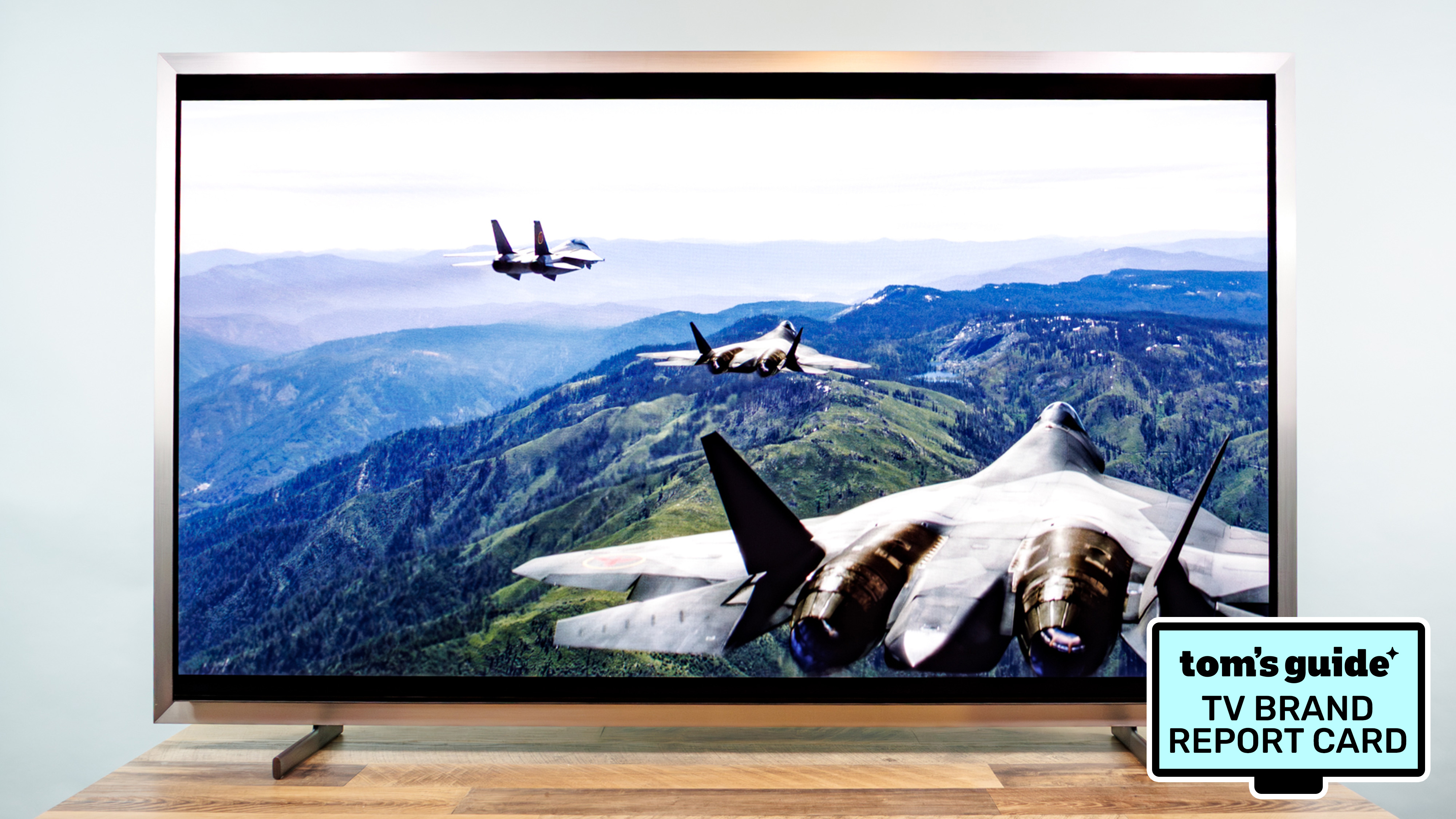 The Samsung S95H QD-OLED TV alongside a badge that reads: "Tom's Guide TV Brand Report Card"
