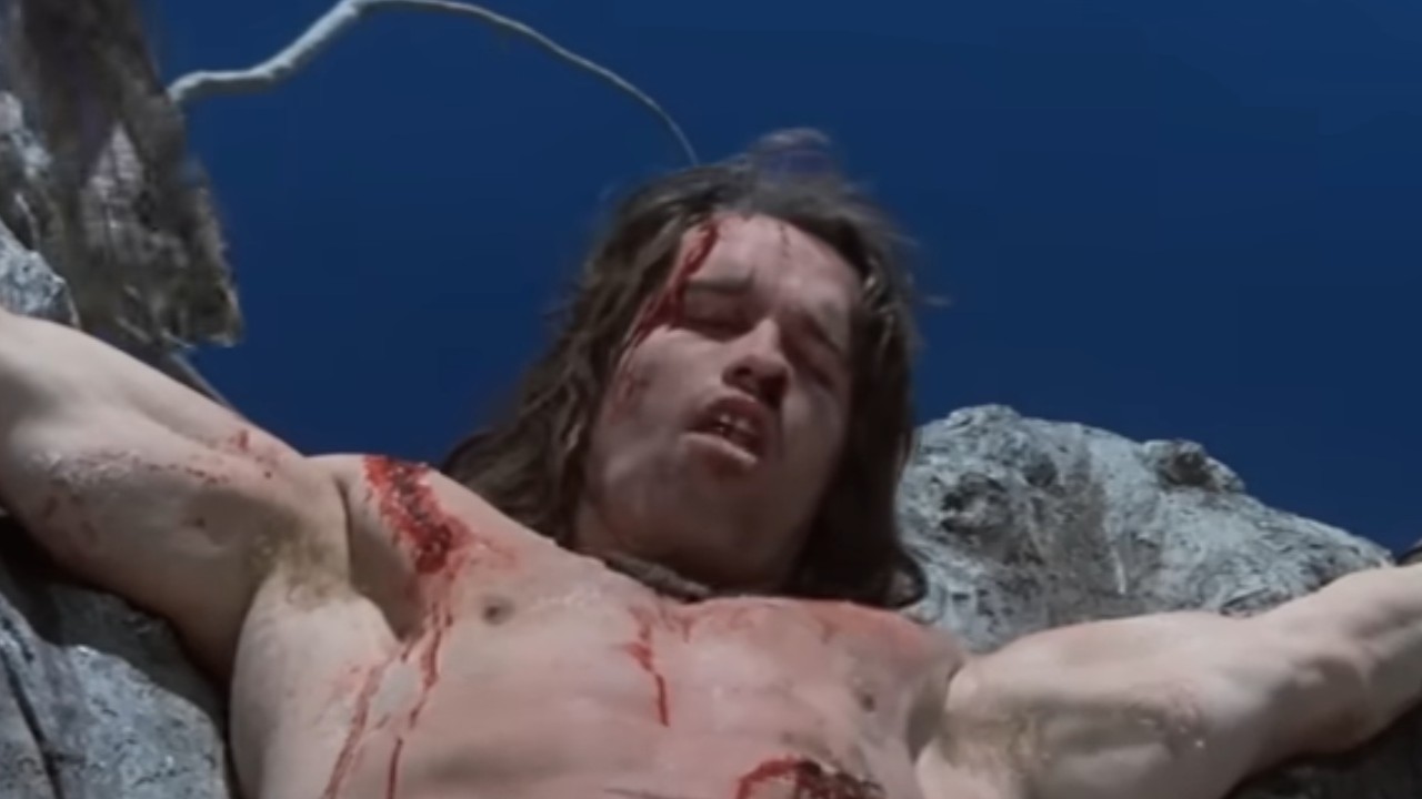Arnold Schwarzenegger tied to a tree in Conan the Barbarian