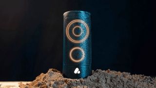 POCA Audio Pine Beat bluetooth speaker sitting in sand