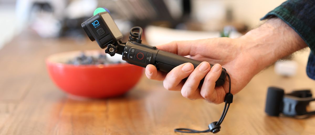 A hand holding the GoPro Volta tripod grip