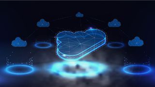 Cloud computing concept image showing digitized cloud symbol above a circuit board with secondary cloud symbols surrounding. 