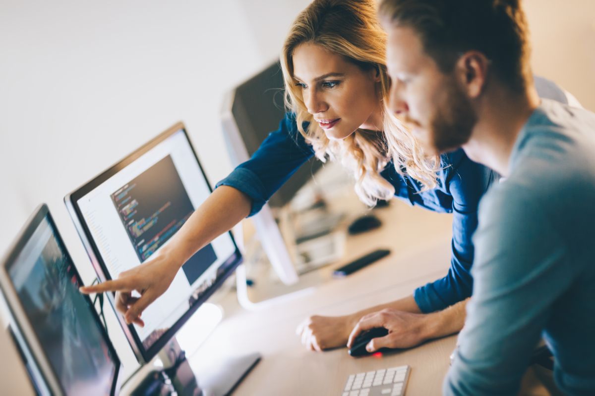 Image of a male and female software developer working together