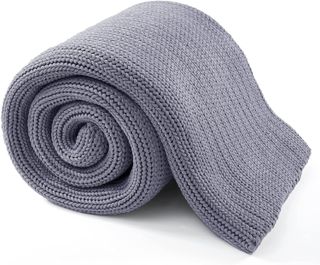 Gray weighted blanket rolled up