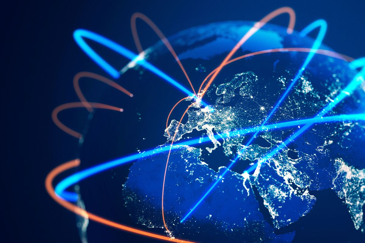 Global communications lines showing beams of light from UK to other global locations