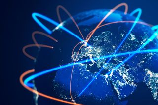 Global communications lines showing beams of light from UK to other global locations