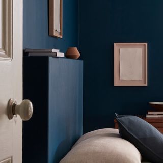 Little Greene's 'Royal Navy' blue paint on a bedroom wall