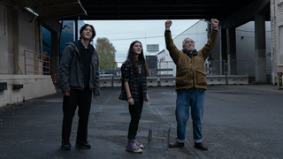Matt (played by Simon Khan), Kaitlyn (Brooklynn Prince) and Jaan (Brian Cox) with his hands raised to the sky await the return of a racing pigeon in 'Little Wing' 