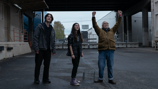 Matt (played by Simon Khan), Kaitlyn (Brooklynn Prince) and Jaan (Brian Cox) with his hands raised to the sky await the return of a racing pigeon in &#039;Little Wing&#039; 