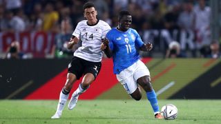 Wilfried Gnonto of Italy and Jamal Musiala of Germany battle for the ball during the UEFA Nations League