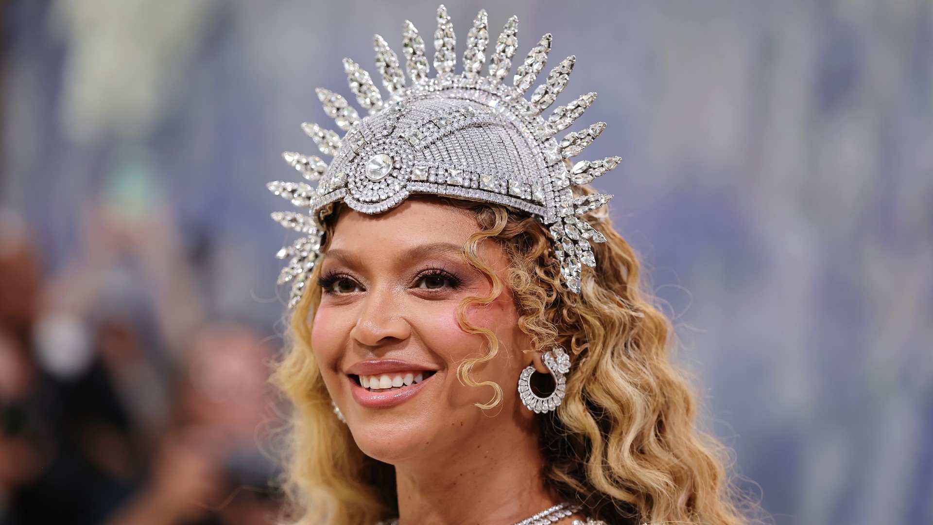 beyonce attends the 2026 met gala wearing a silver headpiece and mermaid curls