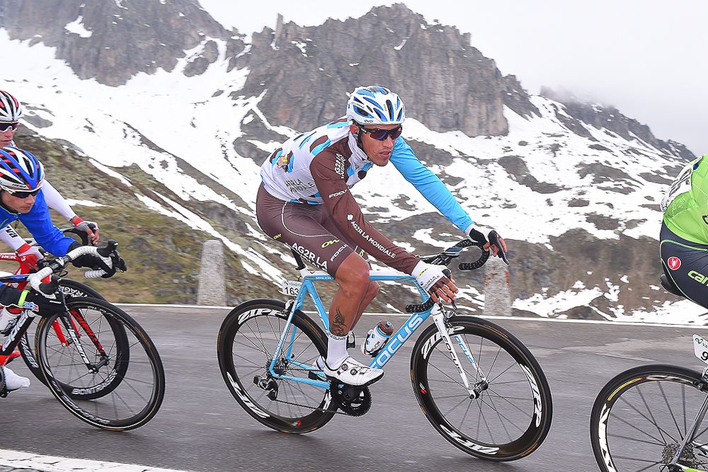 Damien Gaudin climbs into the snow line climbs during stage 5 at Tour de Suisse