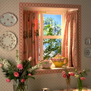room with floral printed walls and flower in vase