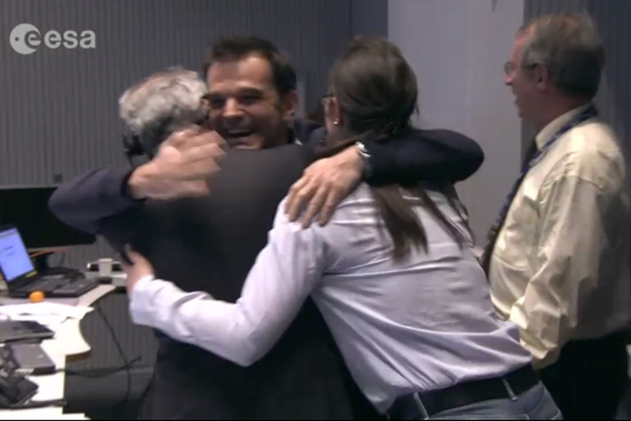 ESA staff members at ESA's European Space Operations Center in Darmstadt, Germany, celebrate the landing of Philae probe on Comet 67P/Churyumov-Gerasimenko, Nov. 12, 2014.