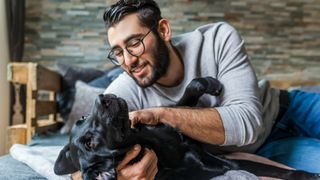 Man playing with dog