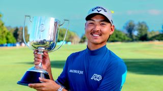 Min Woo Lee holds up the Australian PGA Championship trophy