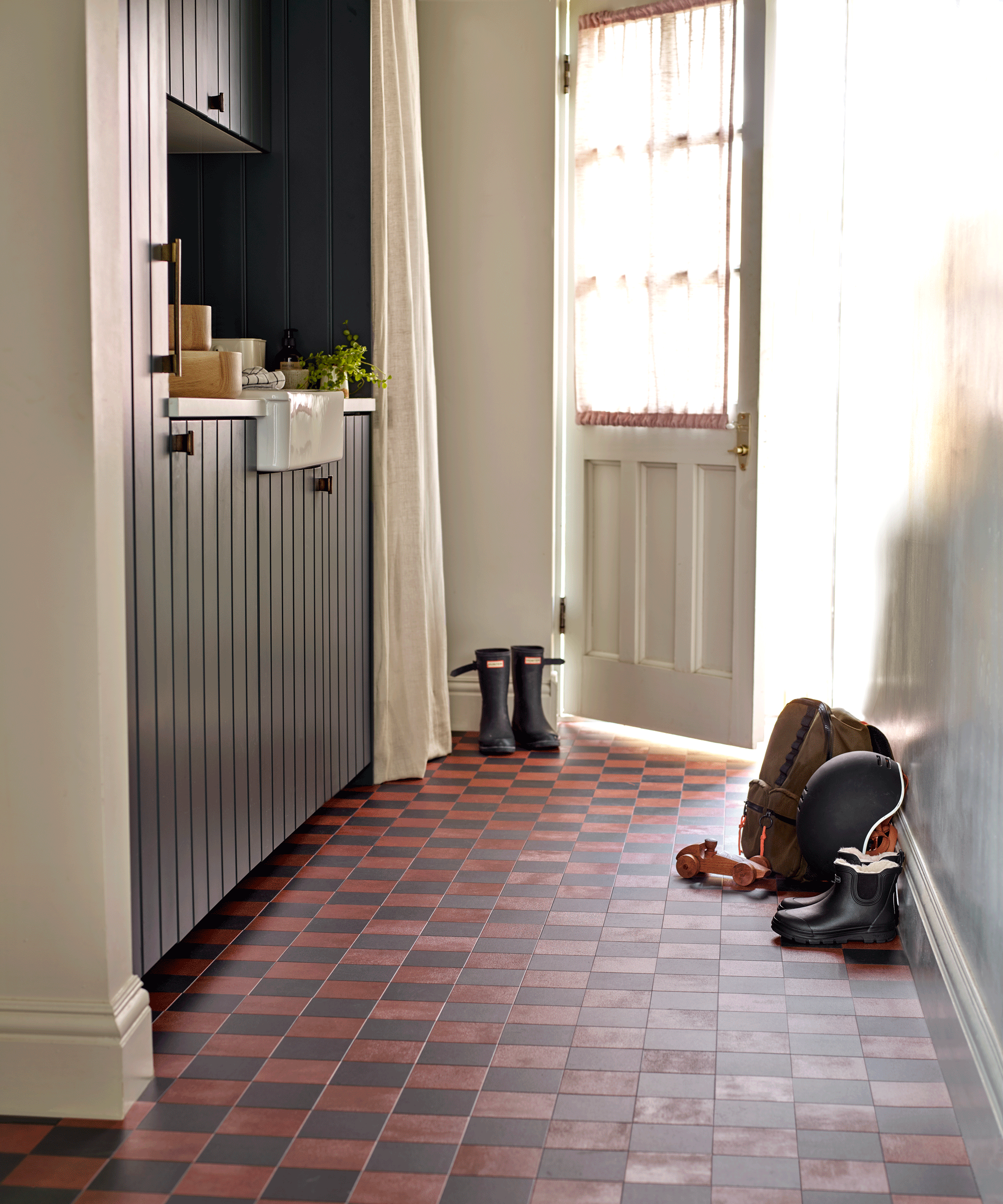 Boot room with vinyl checkered flooring