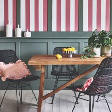 dining room with green panelling and red and white stripe walls