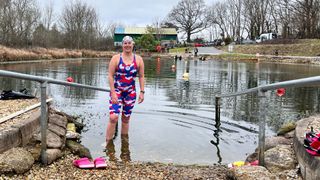 Kate Steels standing at the entrance to Andark Lake in Southampton wearing full team GB kit
