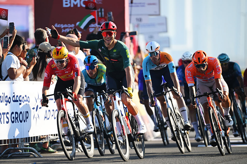 ABU DHABI, UNITED ARAB EMIRATES - FEBRUARY 22: Jonathan Milan of Italy and Team Lidl - Trek - Green Points Jersey celebrates at finish line as stage winner (C) ahead of Erlend Blikra of Norway and Team Uno-X Mobility (L) and Sam Welsford of Australia and Team INEOS Grenadiers (R) during the 8th UAE Tour 2026, Stage 7 a 149km stage from Zayed National Museum to Abu Dhabi Breakwater / #UCIWT / on February 22, 2026 in Abu Dhabi, United Arab Emirates. (Photo by Tim de Waele/Getty Images)