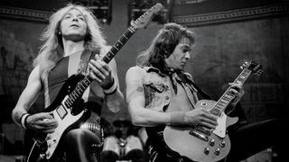 Dave Murray [left] and Adrian Smith perform in Chicago June 16, 1985