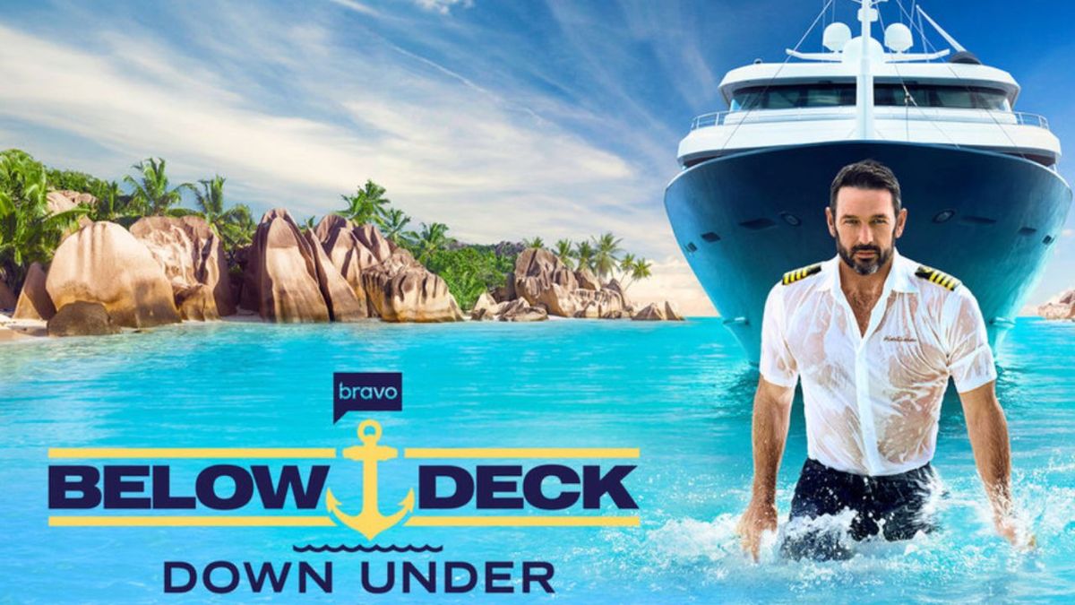 Key art for Below Deck Down Under with the logo on the left and Captain Jason coming out of the water in a wet captain shirt to the right with the super yacht behind him