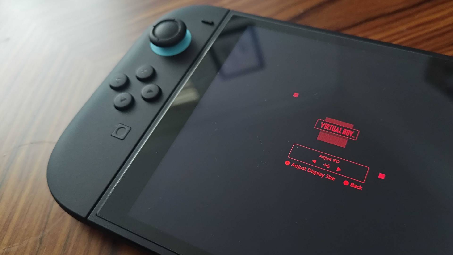 Close up of Switch 2 with Virtual Boy IPD adjustment open.