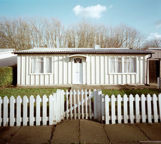 british house with white wall and prefabs